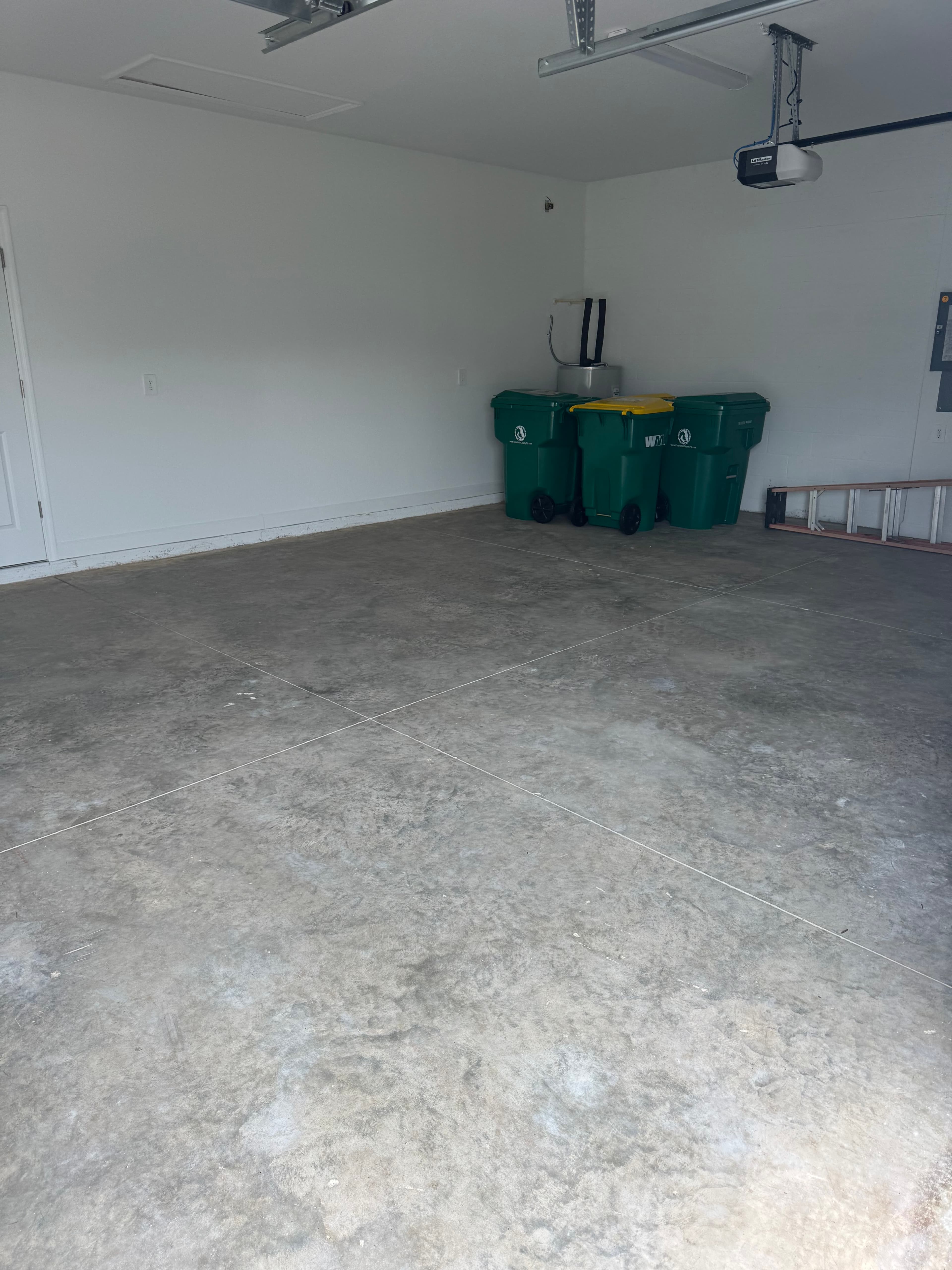 Bare concrete garage floor before coating