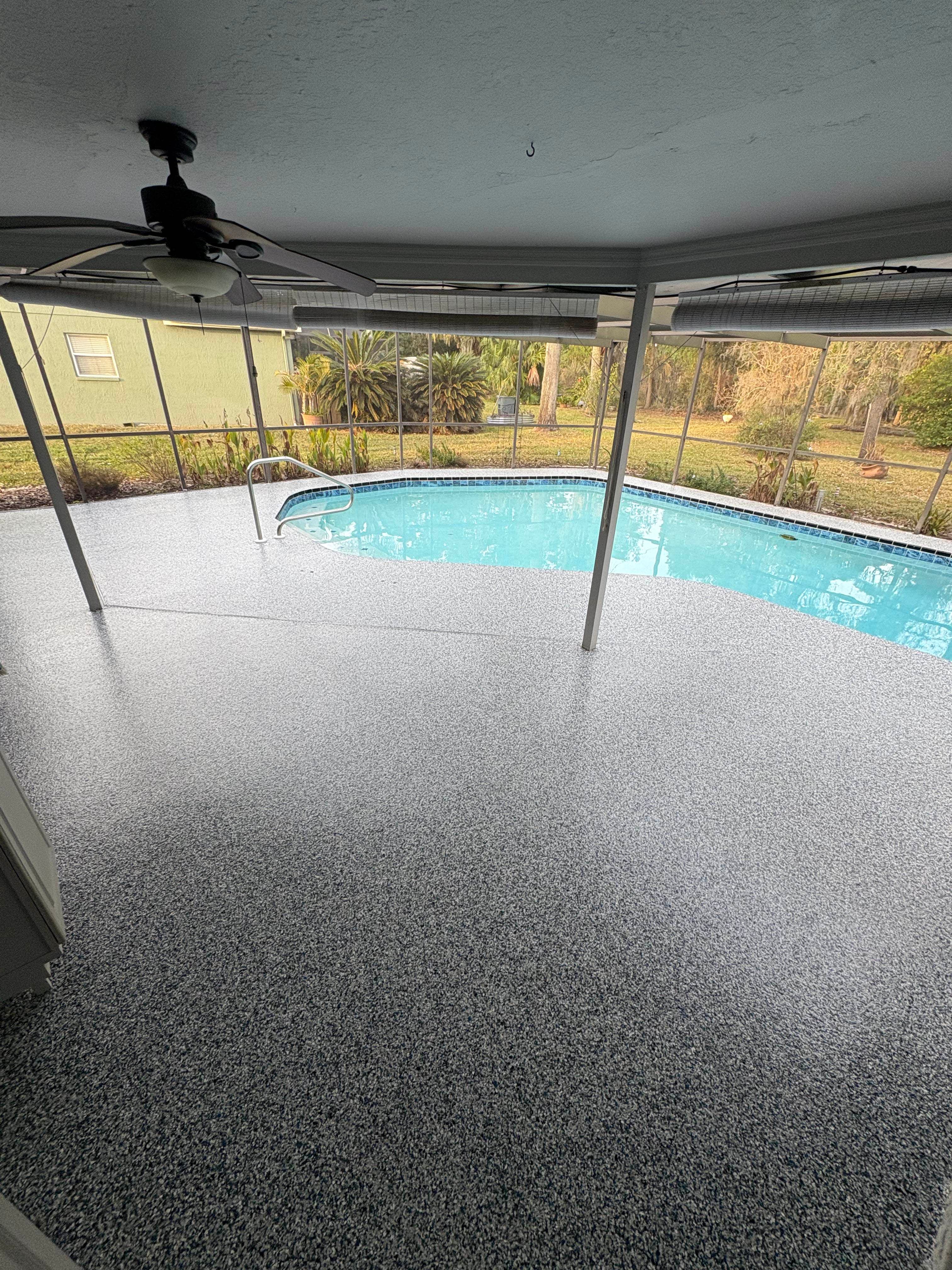 Coated pool deck with flake finish